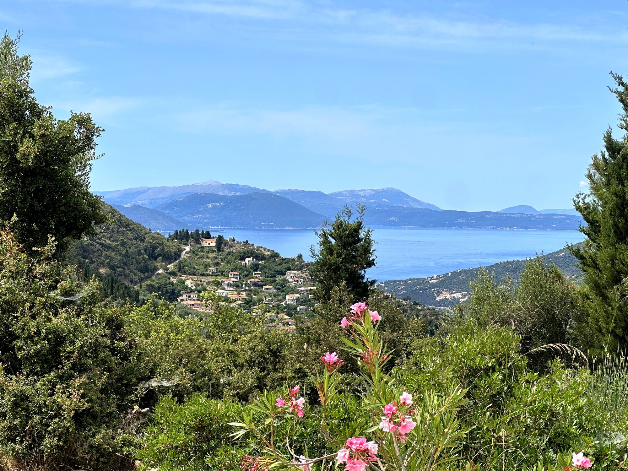 A caïque at anchor in a calm green-blue bay off Lefkada