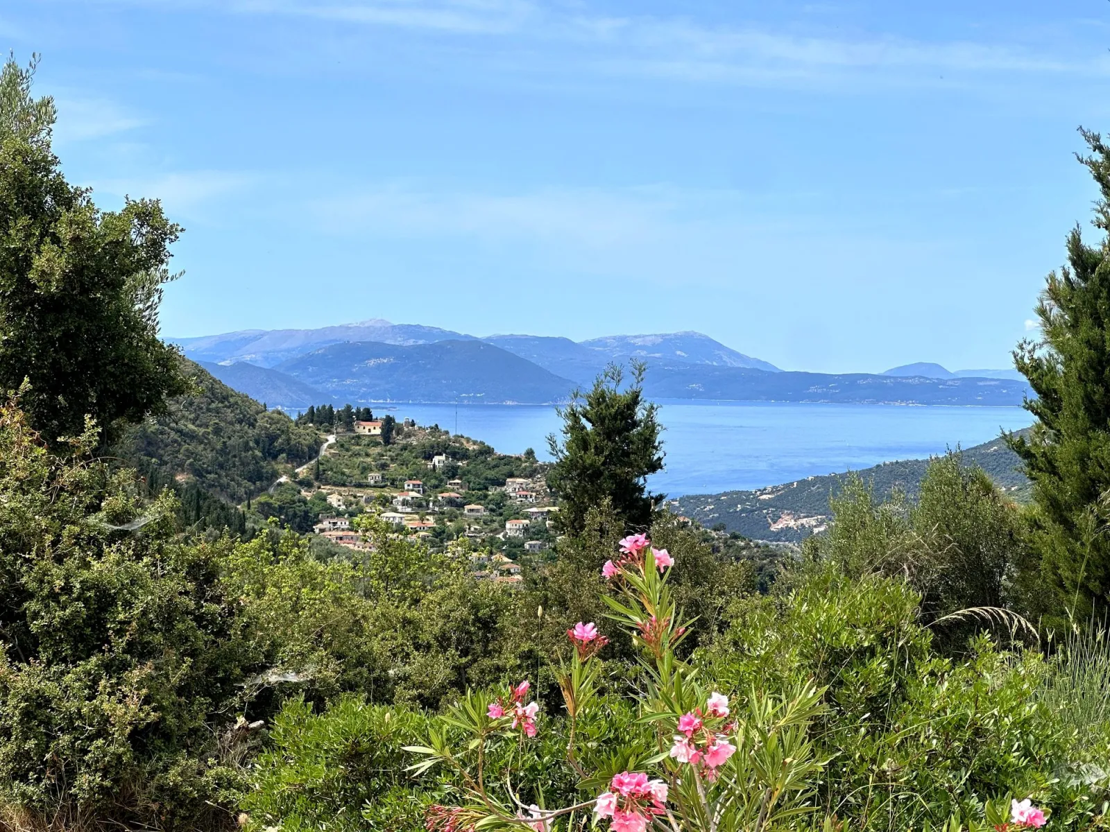 A caïque at anchor in a calm green-blue bay off Lefkada