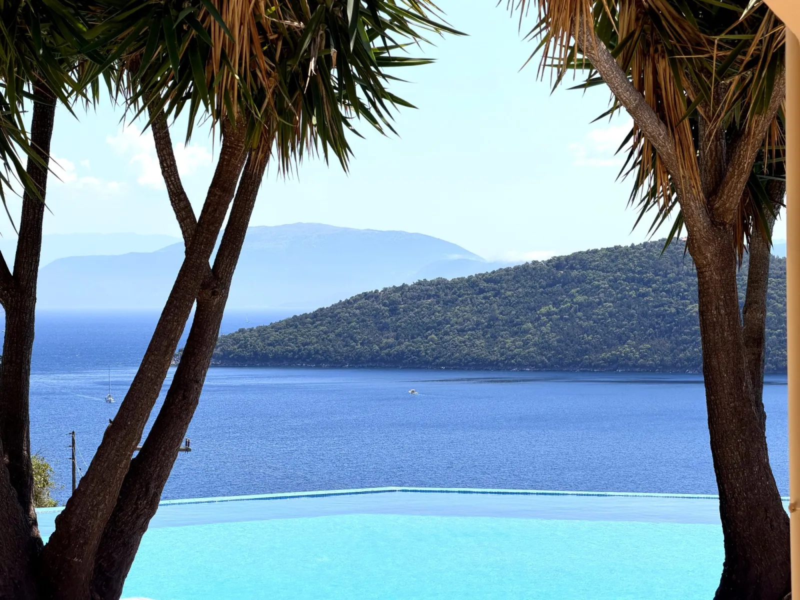 A quiet pebble cove with electric-blue water near Mikros Gialos, Lefkada